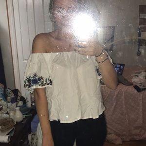 Off the shoulder white and floral shirt